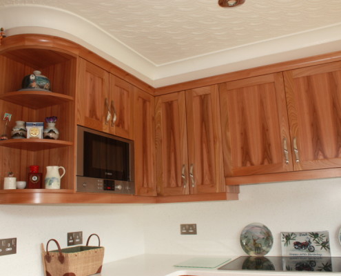 modern kitchen in wych elm with corian worktops